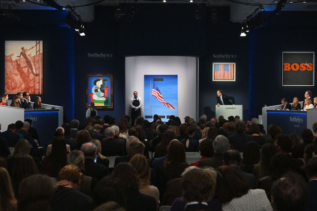 Sotheby's auctioneer Oliver Barker takes bids during Sotheby's auction of Emily Fisher Landau collection, including Picasso's "Femme à la montre" in New York City on November 8, 2023. Pablo Picasso's 'Femme a la montre' from 1932 is expected to fetch at least 120 million USD. Other works up for sale include pieces by Jasper Johns, Willem de Kooning, Mark Rothko and Andy Warhol. The sale consists of around 120 pieces from Landau's prestigious collection which is overall expected to realise well over 400 million USD. (Photo by ANGELA WEISS / AFP) (Photo by ANGELA WEISS/AFP via Getty Images)